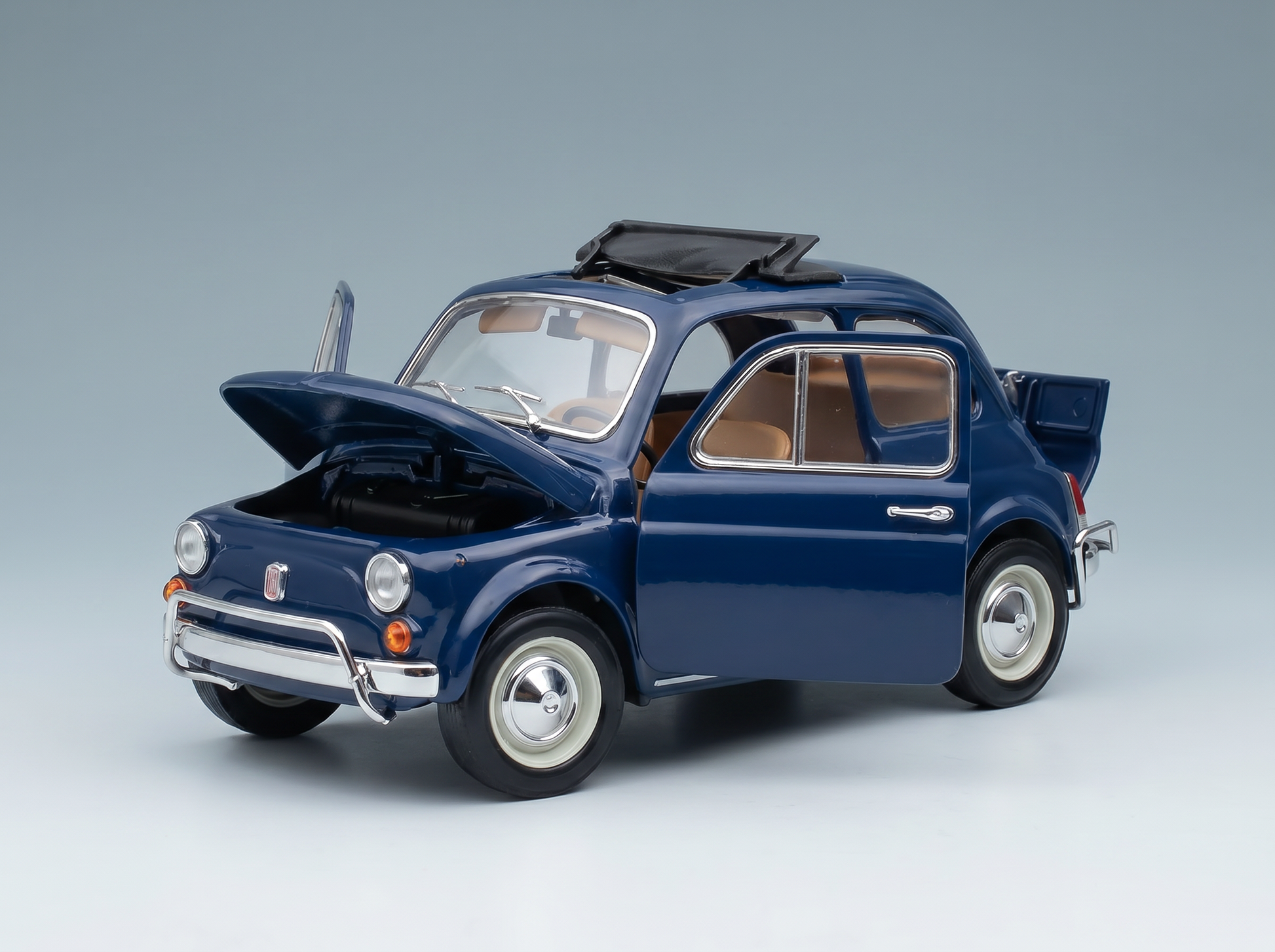Blue Fiat 500 scale model car with open doors and hood, detailed interior, from Vroomi