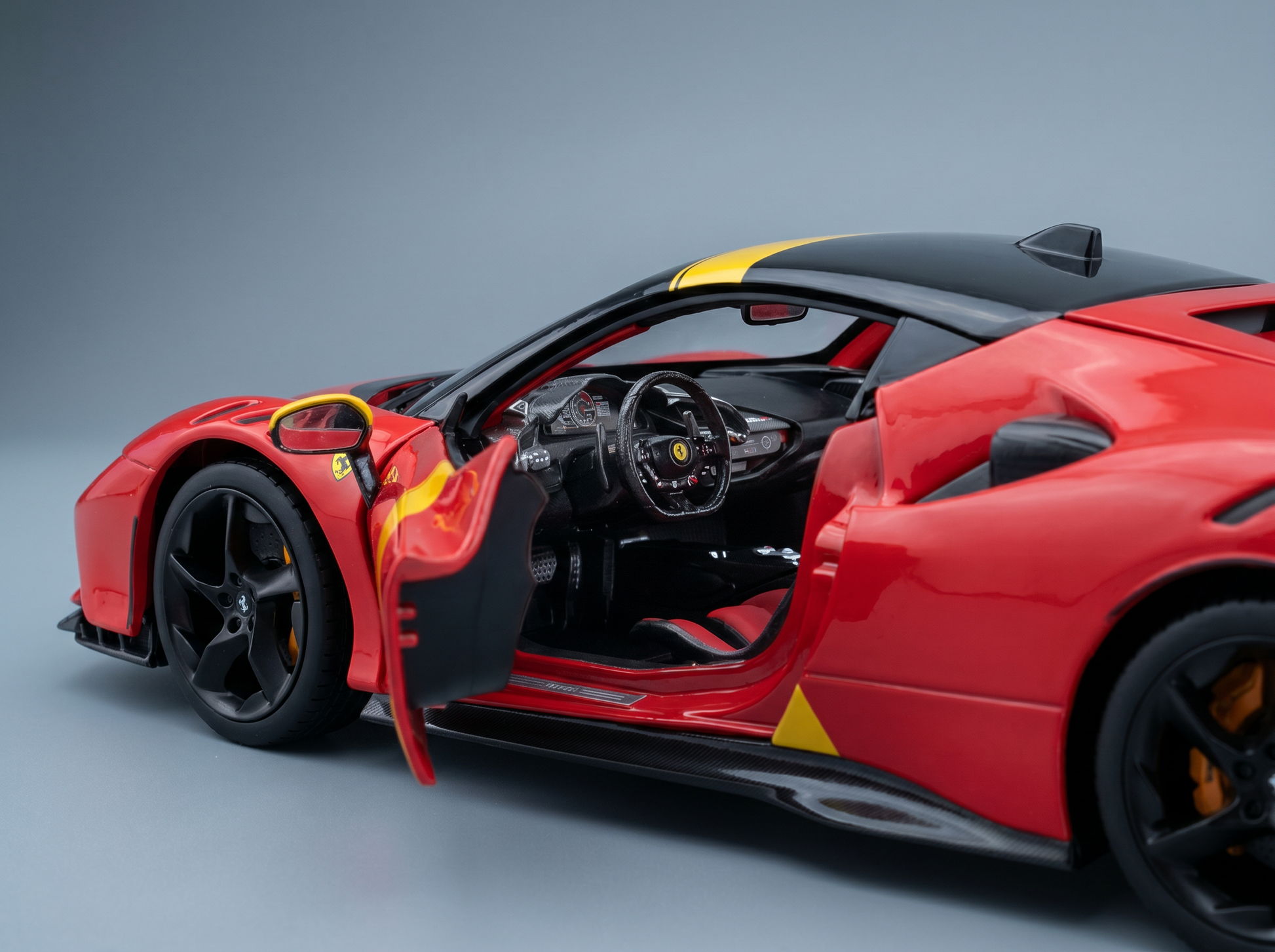Red scale model car with open doors, detailed interior, and Vroomi branding for collectors.