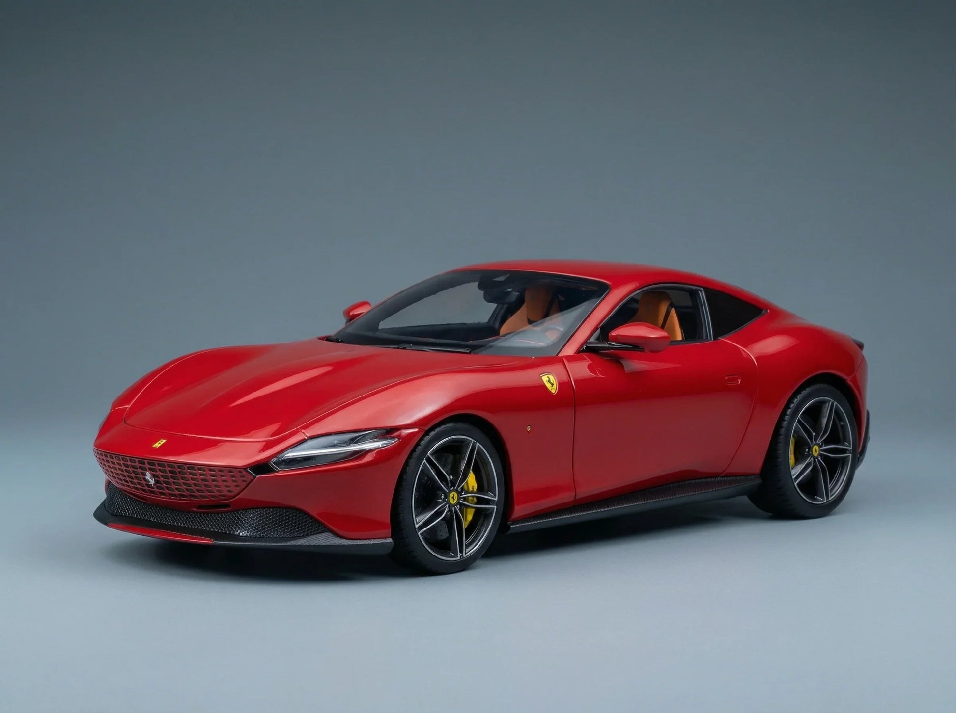 Red Ferrari scale model car with yellow brake calipers, showcased by Vroomi for collectors