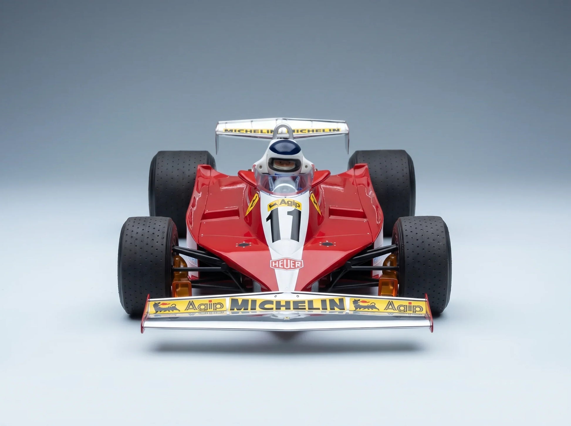 FERRARI – F1 312T3 N 11, SIEGER DES BRITISCHEN GRAND PRIX (mit Fahrerfigur) 1978 CARLOS REUTEMANN – ROT-WEISS Modellauto auf Vroomi