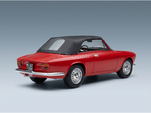 Red scale model car with black soft top, detailed wheels and license plate, showcased by Vroomi