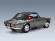 Grey scale model car with black soft top and red interior, showcased by Vroomi for collectors