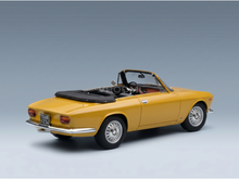 Yellow convertible scale model car with black soft top, detailed interior, and classic design from Vroomi