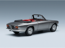 Silver convertible scale model car with red interior, showcased by Vroomi for collectors