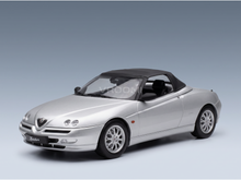 Silver Alfa Romeo Spider scale model car from Vroomi, featuring black soft top and detailed alloy wheels.