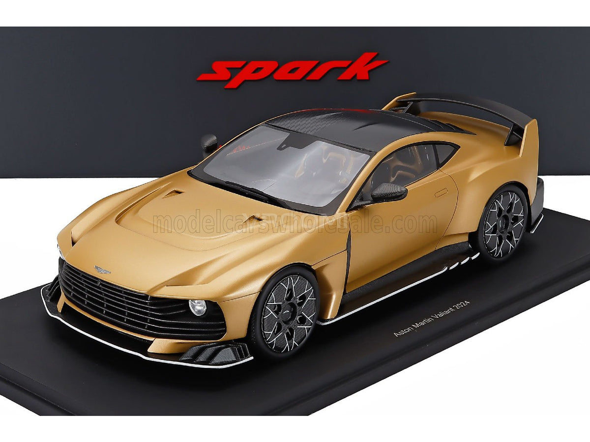 Gold Aston Martin Valiant 2024 scale model car by Spark, displayed on black base — Vroomi