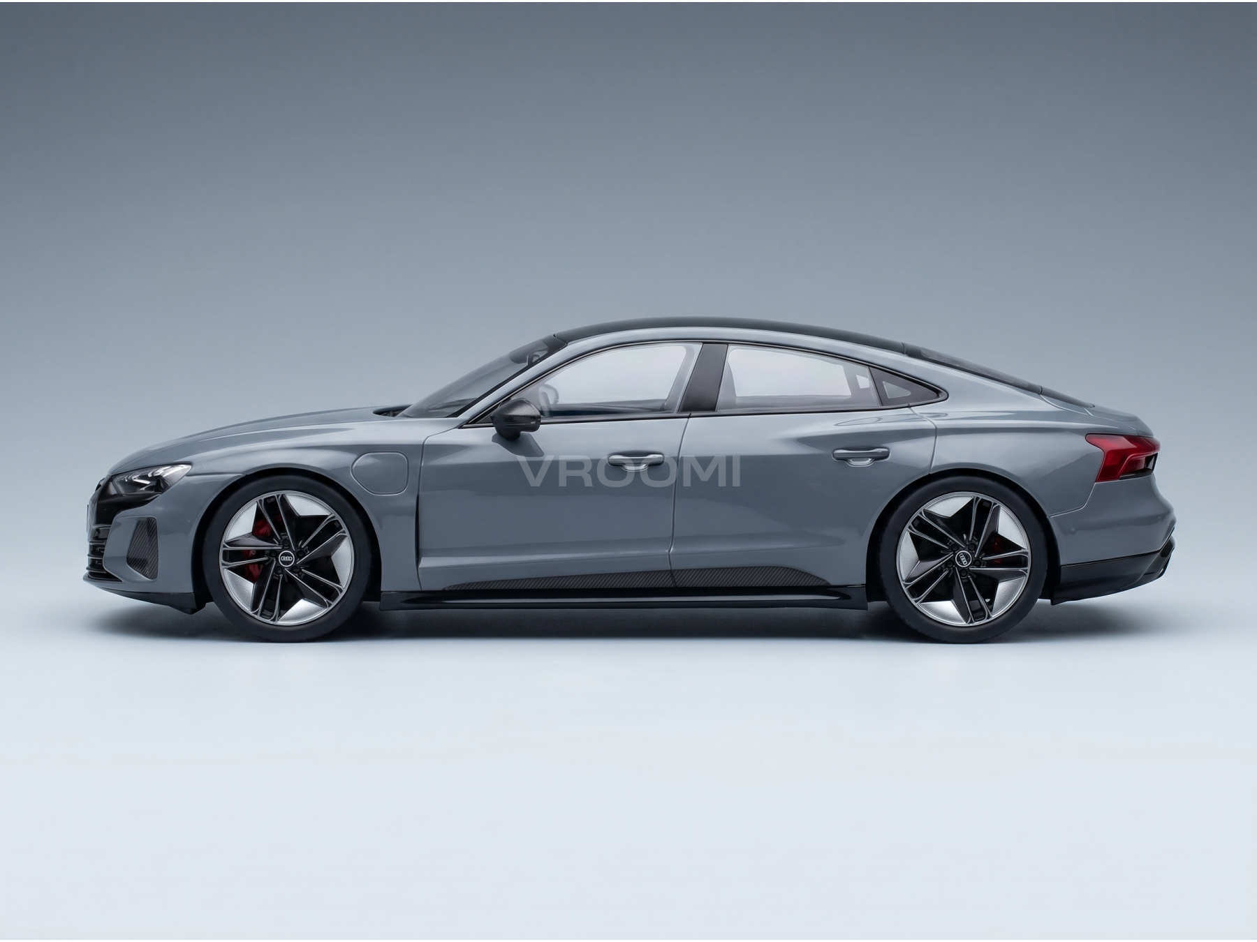 Gray Audi RS e-tron GT scale model car with black accents, showcased by Vroomi for collectors.