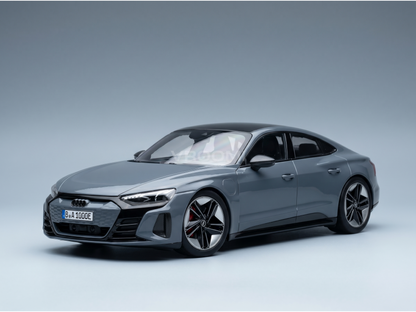 Gray Audi RS e-tron GT scale model car with black roof and red brake calipers, showcased by Vroomi