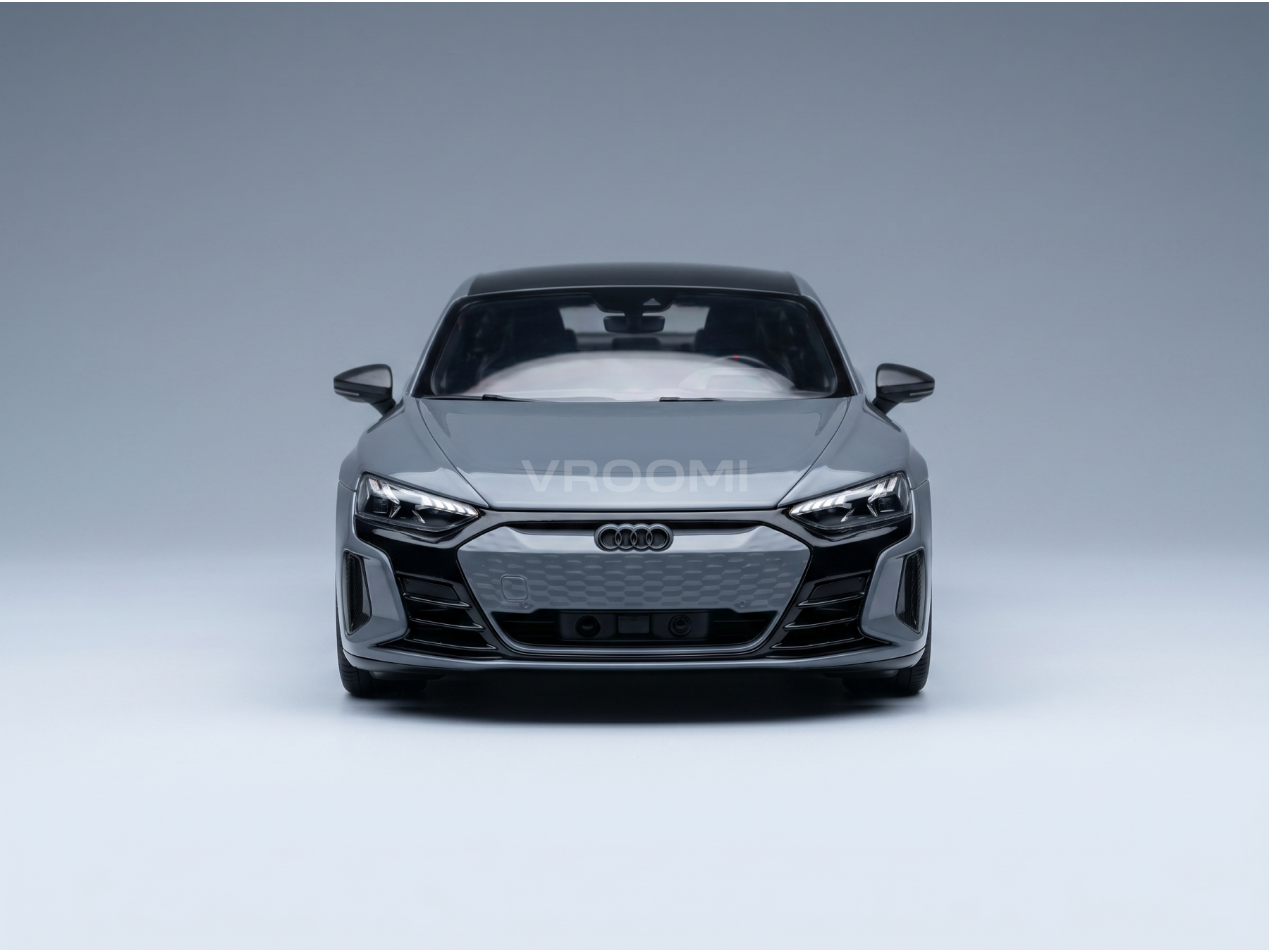 Front view of a gray Audi e-tron GT scale model car from Vroomi, showcasing sleek headlights and grille design.
