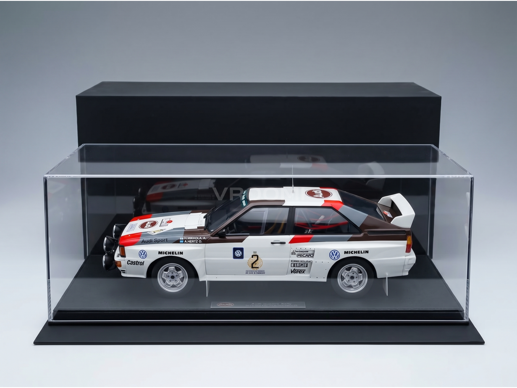 Audi Quattro Rally scale model car in display case, featuring Michelin and Castrol branding, available at Vroomi