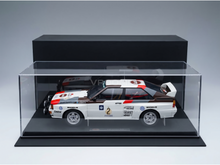 Audi Quattro Rally scale model car in display case, featuring Michelin and Castrol branding, available at Vroomi