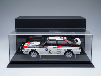 Audi Quattro Rally scale model car in display case, featuring Michelin and Castrol branding, available at Vroomi