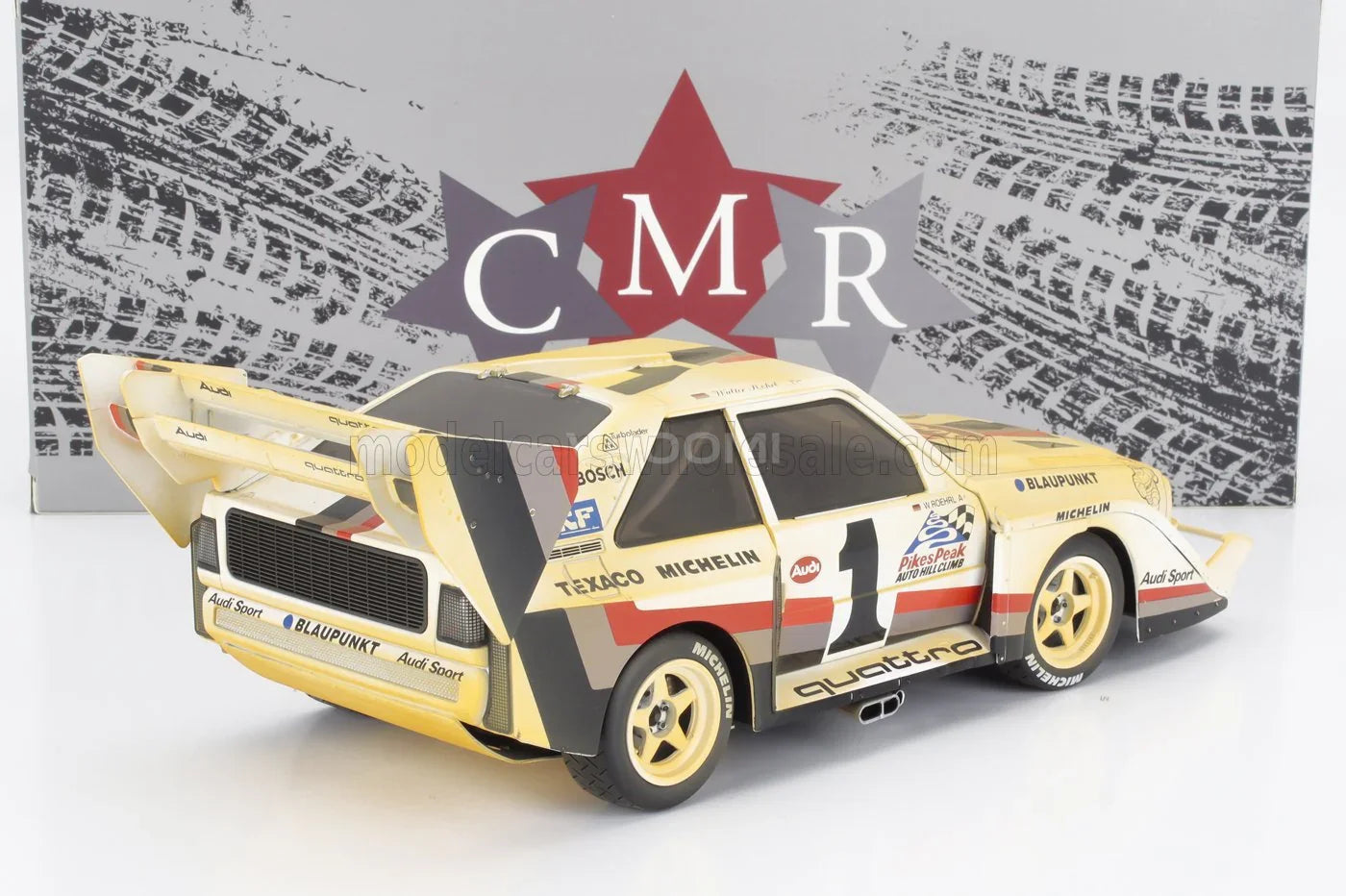 Audi Quattro rally scale model car with Texaco and Michelin livery, displayed at Vroomi