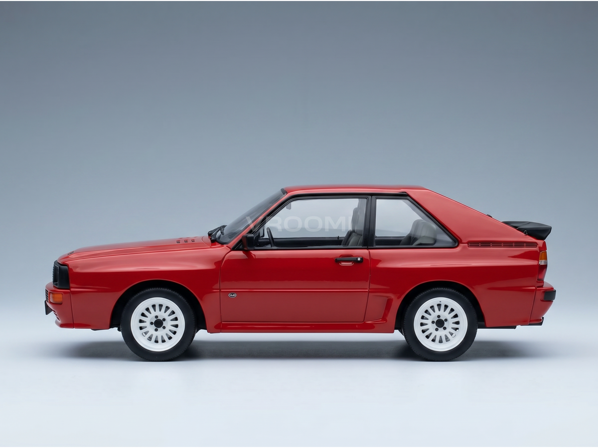 Red Lancia Delta Integrale scale model car with white wheels, showcased by Vroomi for collectors.