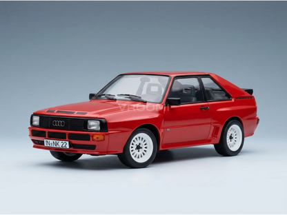 Red Audi Quattro scale model car with white wheels, showcased by Vroomi for collectors.