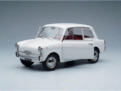 Coche clásico a escala de los años 60, de color blanco y con el interior rojo, presentado por Vroomi para coleccionistas