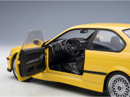 Yellow BMW M3 scale model car with open doors, detailed interior, at Vroomi