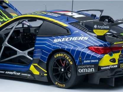Blue and yellow BMW M4 GT3 scale model car with Skechers, Goodyear, and Oman livery, featuring open door and roll cage, from Vroomi.