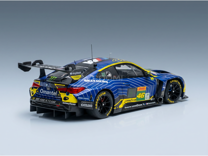 Blue and yellow BMW M4 GT3 scale model car with sponsor decals, showcased by Vroomi for collectors.