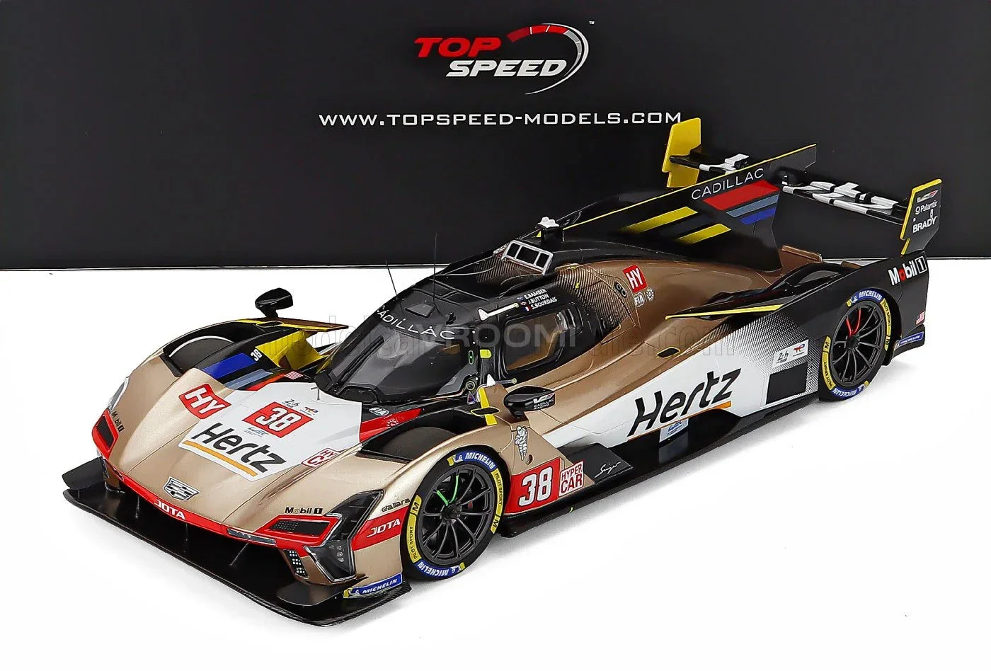 CADILLAC - SERIE V R 5,5 L V8 TEAM HERTZ JOTA N 38 24 h DE LE MANS 2025 EARL BAMBER - SEBASTIEN BOURDAIS - JENSON BUTTON - BLANCO DORADO NEGRO Vroomi Tienda de maquetas de coches
