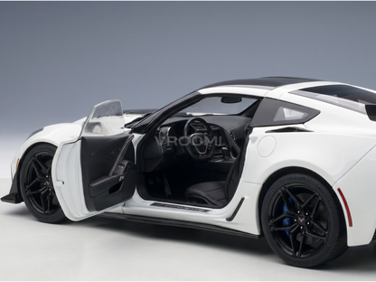 White scale model car with open doors, detailed interior, black wheels — Vroomi collector's replica
