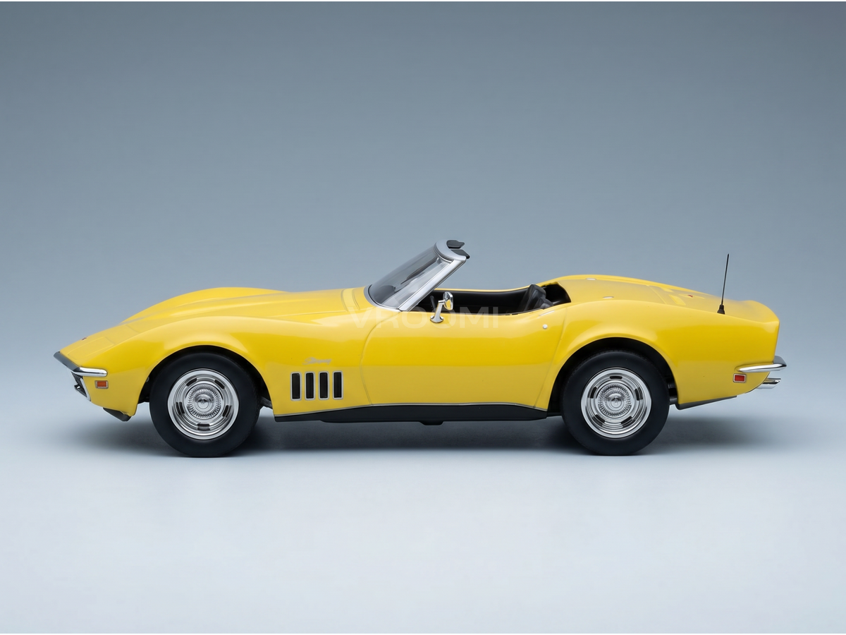Modellino in scala Corvette Stingray cabriolet 1968 giallo di Vroomi, con cerchi cromati e design classico.