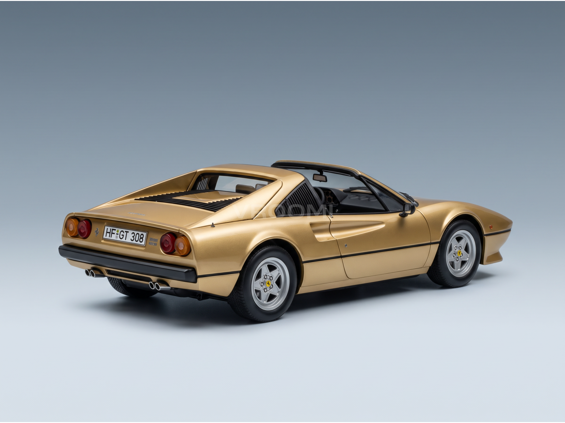 Golden Ferrari 308 GTS scale model car from Vroomi, showcasing detailed rear design and classic sports car styling.