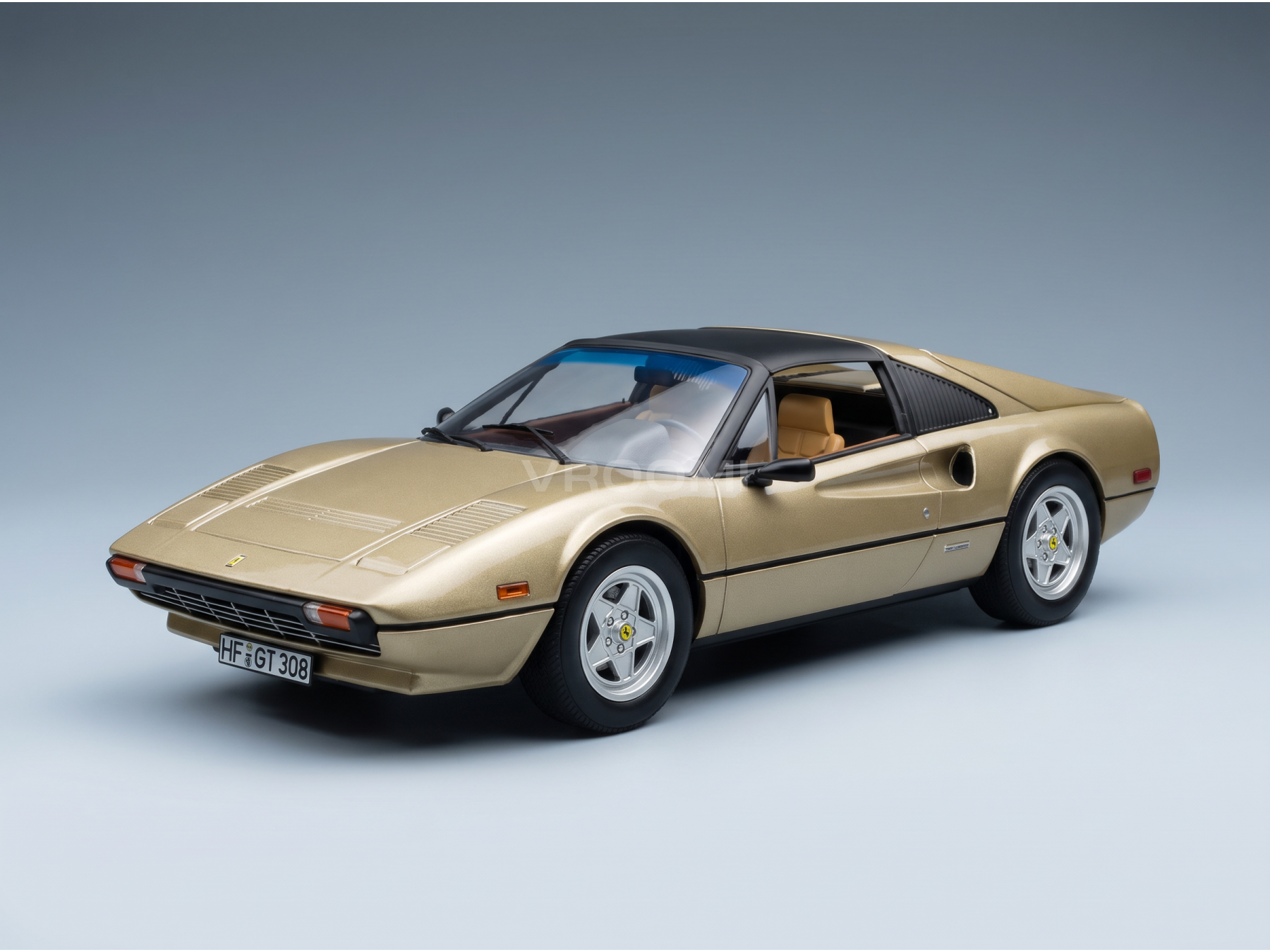 Gold Ferrari 308 GTS scale model car by Vroomi, detailed die-cast replica with tan interior and black roof
