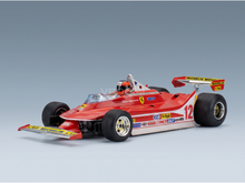 Maqueta a escala de un Ferrari F1 rojo con la decoración de Gilles Villeneuve, con pegatinas de Michelin y Agip, de Vroomi.