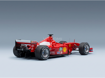 Red Ferrari F1 scale model car with Shell, FedEx, and Bridgestone logos, showcased by Vroomi for collectors.