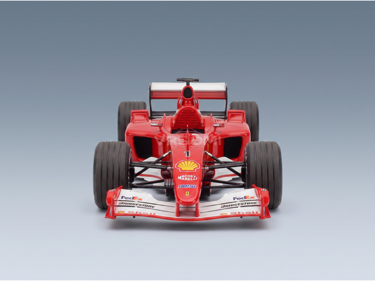 Red Ferrari F1 scale model car with Shell, FedEx, Bridgestone logos, Vroomi collection