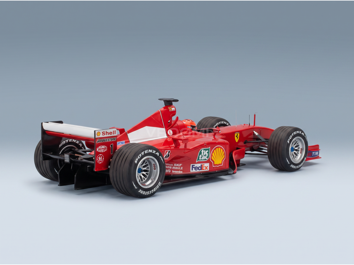 Red Ferrari F1 scale model car with Shell, FedEx, and Bridgestone logos, showcased by Vroomi for collectors.
