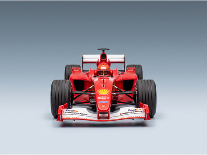 Red Ferrari F1 scale model car with Shell, FedEx, Bridgestone logos — Vroomi collector replica