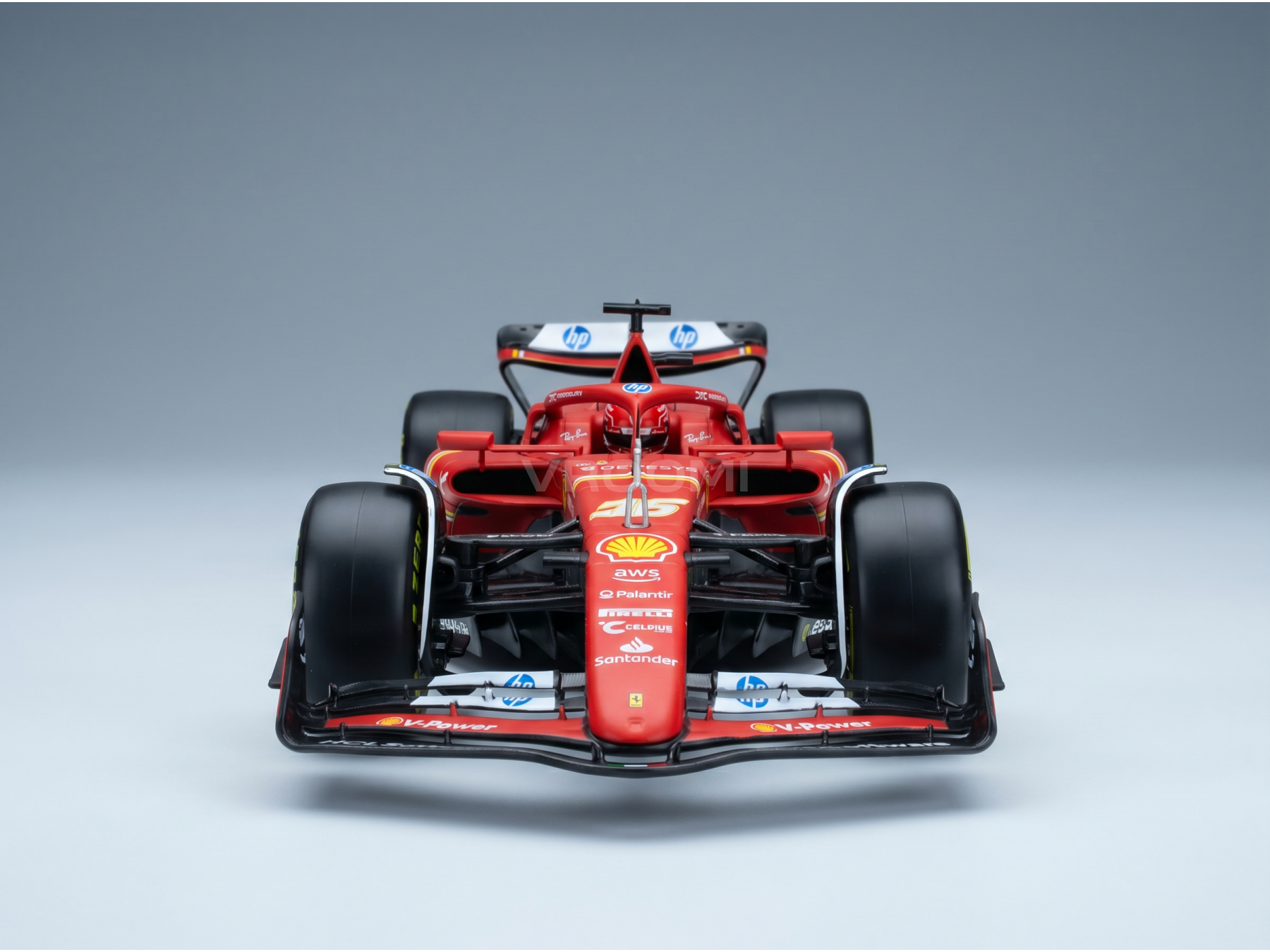 Maqueta a escala de un Ferrari F1 rojo con los logotipos de Shell y HP, presentada por Vroomi para coleccionistas.