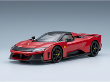 Maqueta de un Ferrari rojo con detalles en negro, presentada por Vroomi para coleccionistas y aficionados al automovilismo.