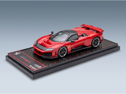 Red Ferrari F80 scale model car on display base, Vroomi collector's edition