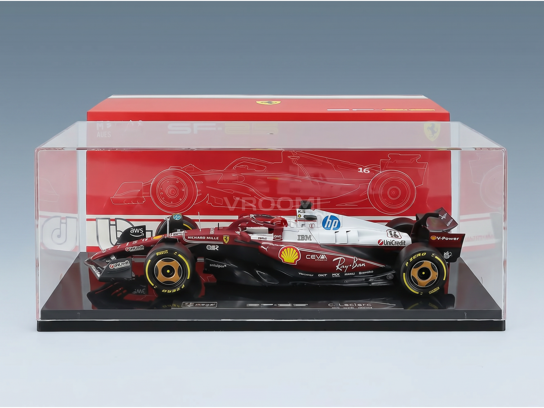 Ferrari SF-25 F1 model car with Charles Leclerc branding, in display case.