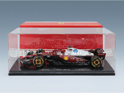Ferrari SF-25 F1 model car with Charles Leclerc branding, in display case.