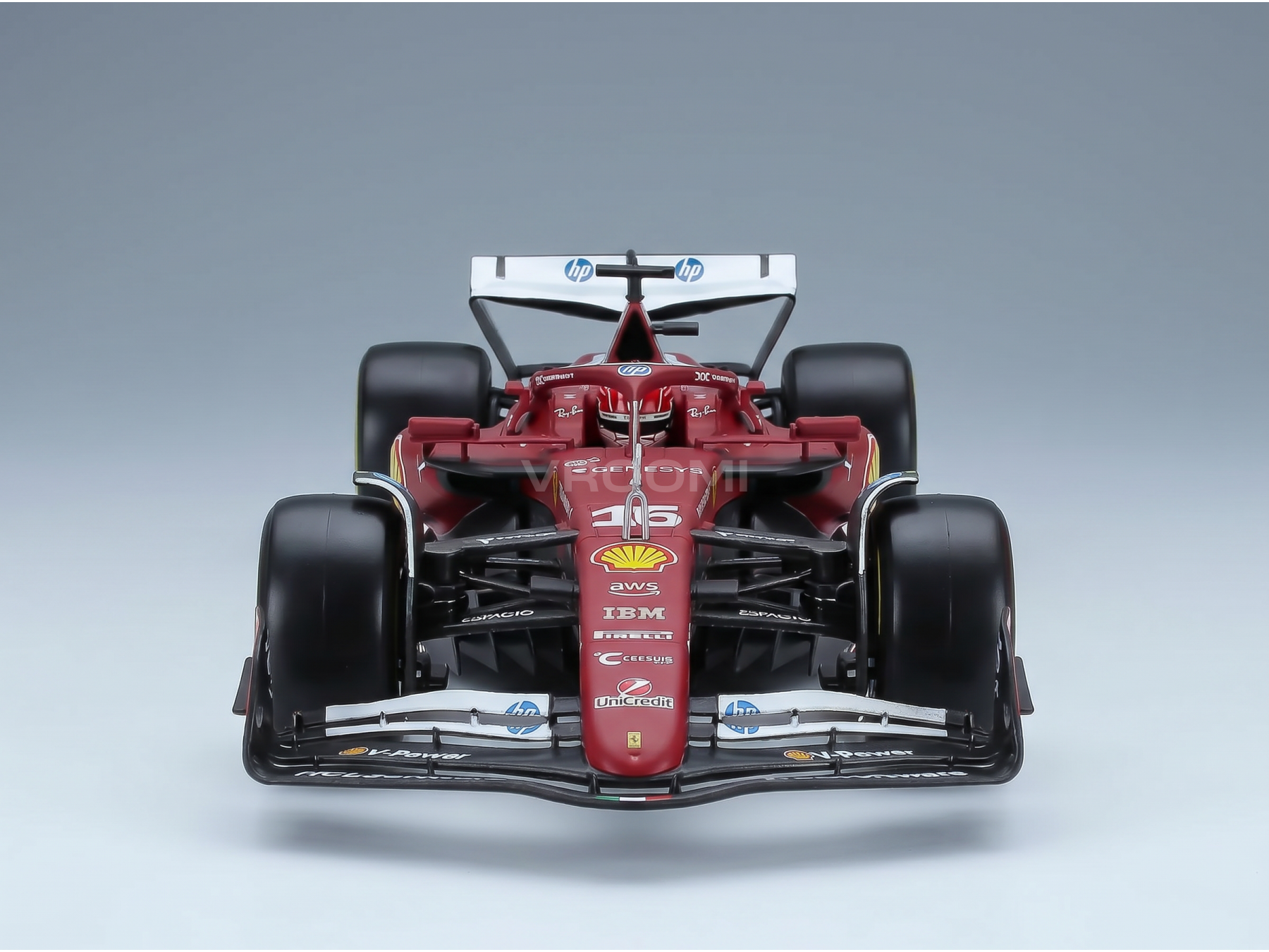 Maquette de voiture de F1 Ferrari rouge, arborant les logos Shell et HP, présentée par Vroomi à l'intention des collectionneurs.