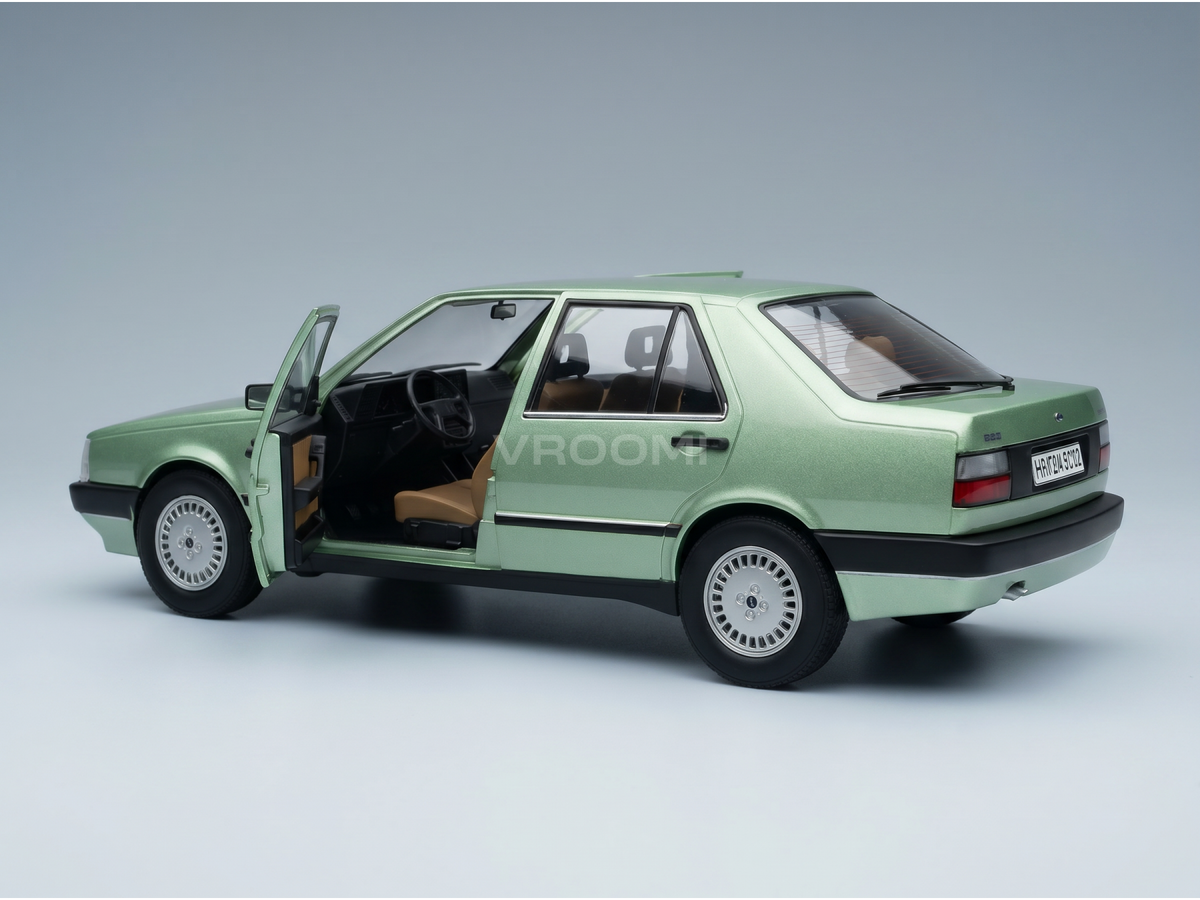 Green scale model car with open door, detailed interior, from Vroomi collection