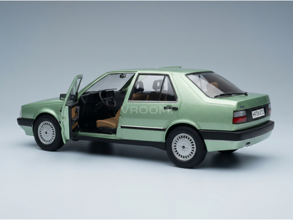 Green scale model car with open door, detailed interior, from Vroomi collection