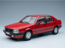 Rode schaalmodelauto met beige interieur, gepresenteerd door Vroomi voor verzamelaars
