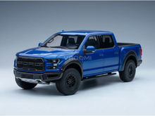 Maqueta a escala del Ford Raptor azul de Vroomi, réplica detallada de fundición a presión con llantas y parrilla negras.