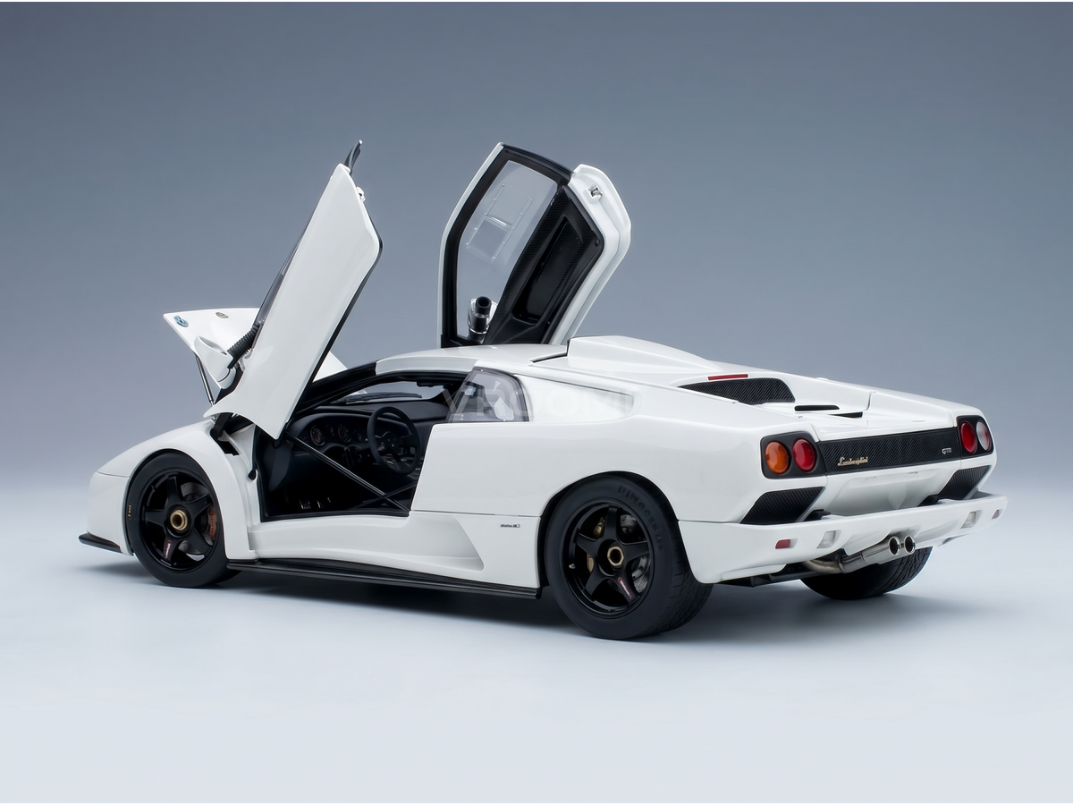 Voiture miniature Lamborghini blanche avec portes ouvertes, présentée par Vroomi pour les collectionneurs.