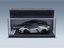 Silver Lamborghini Revuelto scale model car in clear display case by LookSmart, curated by Vroomi for collectors.