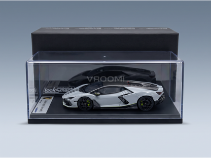 Silver Lamborghini Revuelto scale model car in clear display case by LookSmart, curated by Vroomi for collectors.