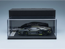 Black Lamborghini Revuelto scale model car with neon accents in Vroomi display case