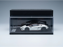 White Lamborghini Huracán scale model car in clear display case by LookSmart, curated by Vroomi for collectors.