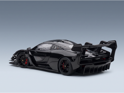 Black McLaren Senna scale model car with carbon fiber details, red brake calipers, and rear wing — Vroomi