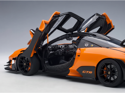 Orange and black GTR scale model car with open doors, detailed interior, from Vroomi
